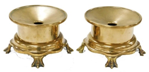 A pair of Chinese brass censers, of circular form, raised on a lappet base, on four claw feet, 20.5cm wide.