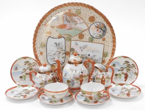 A 20thC Meiji period Japanese Kutani porcelain part tea service, comprising teapot, 17cm high, two handled sugar bowl and cover, milk jug, two teacups and six saucers, together with an associated tray of circular form with a scalloped edge, 33cm diameter.