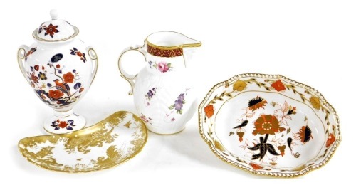 An Aynsley porcelain twin handed vase and cover, decorated with birds, Royal Crown Derby porcelain Gold Aves salad dish, Coalport porcelain copy of the Caughley Mask-Head jug, and a Royal Crown Derby porcelain Imari bowl, floral decorated. (4)
