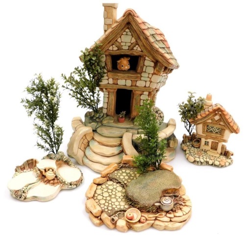 A Pendelfin model of The Large House, together with Cobble Cottage, picnic stand with campfire, and a further stand with a kettle on the fire, as well as collector's handbooks and brochures for Pendelfin. (a quantity)