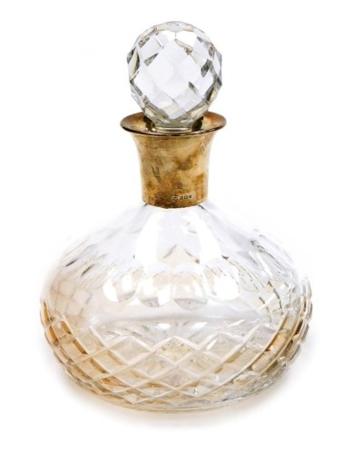 An Elizabeth II cut glass decanter, with silver collar, London 1997, 21cm high.