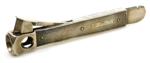 An Elizabeth II silver cigar cutter, with engine turned decoration, rectangular reserve engraved Booths, and to the steel 'With Grateful Thanks from the Lord's Taverners', Birmingham 1966, 3.66oz all in.