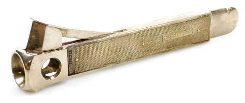 An Elizabeth II silver cigar cutter, with engine turned decoration, Birmingham 1971, 3.82oz.