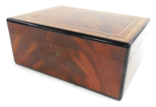 A Reindeer mahogany and cross banded humidor, with a fitted interior, 13cm high, 31cm wide, 22cm deep.