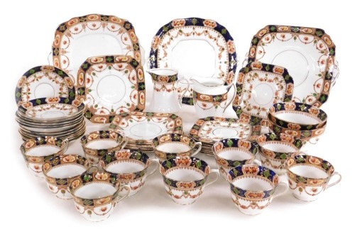 An early 20thC Royal Albion china porcelain tea service, with printed and clobbered decoration, comprising three bread plates, two cream jugs, pair of sugar bowls, eleven teacups, twelve saucers, and fourteen tea plates.