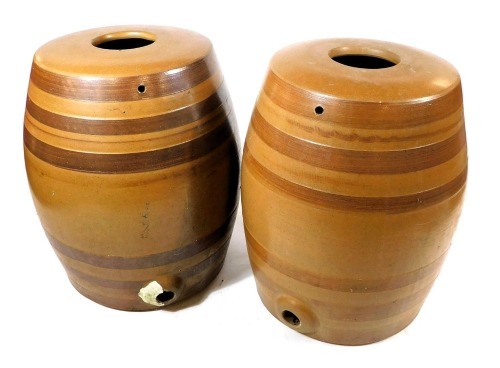 Two early 20thC banded brown stoneware barrels, numbered 5 and 6, 42cm high.