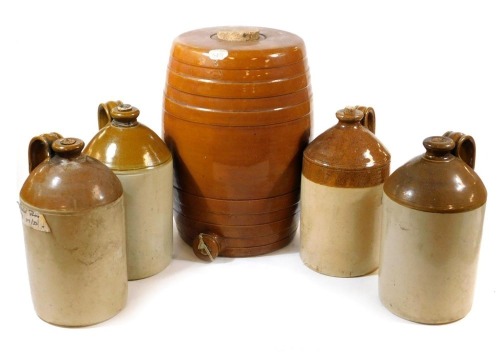 An early 20thC brown stoneware barrel, with a cork stopper, 44cm high, together with four two tone stoneware flagons. (5)