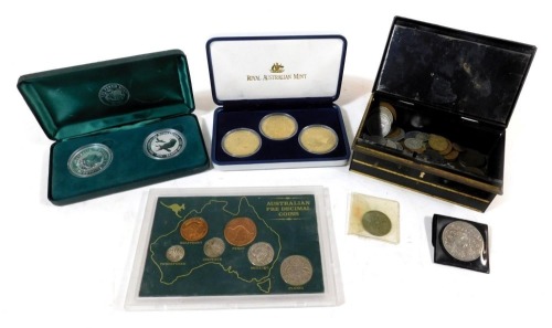 A XVII Commonwealth Games three coin set, Australian five dollars, 2002, boxed with certificate, an Australian pre decimal coin set, pair of silver Australian Kookaburra 1oz one dollars, boxed, and a tin of assorted coinage.