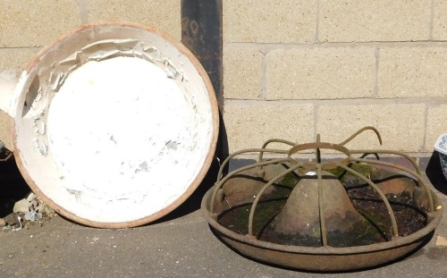 A vintage cast iron livestock feeder, of circular compartmentalised form, 89cm wide.