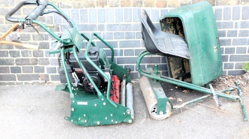 An Atco Royale B24E electric ride on lawn mower, with chargeable battery pack.