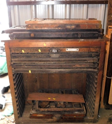 A late 19thC John Haddon and Company pine cased compositor's chest, containing various drawers with compositor's letters, 96cm high, 97cm wide, 42cm deep.
