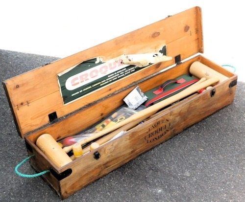 A Jacques croquet set, pine boxed, 110cm wide.