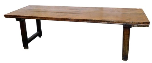 An 18thC elm refectory type table, 76cm high, 245cm wide, 90cm deep.