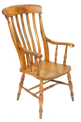 A Victorian oak and elm lath back kitchen chair, raised on turned legs united by a double H frame stretcher, 57cm wide.