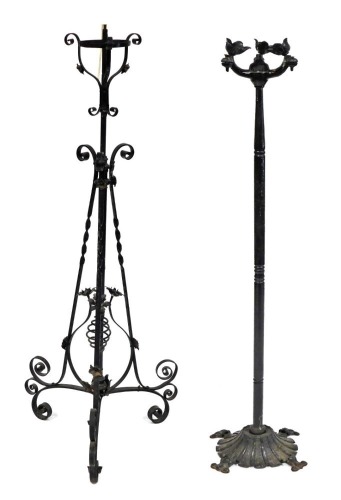 A Victorian cast iron standard oil lamp frame, of scrolling and floral form, later converted for electricity, 158cm high, and a further cast iron standard lamp frame, 138cm high. (2) Buyer Note: WARNING! This lot contains untested or unsafe electrical ite