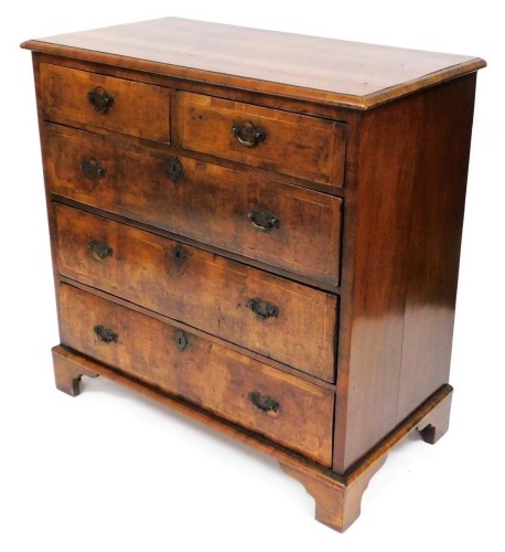 A George II walnut chest, of two short over three long drawers, raised on bracket feet, 98cm high, 98cm wide, 51cm deep.