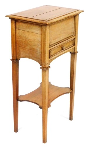 An Edwardian mahogany and line inlaid sewing box, the hinged lid opening to reveal a fitted interior, above a frieze drawer, raised on tapering square legs united by an undertier, 80cm high, 41cm wide, 31cm deep.