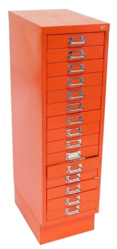 A Ryman red metal chest, of fifteen drawers, containing sewing and dress making materials, 98cm high, 28cm wide, 47cm deep.