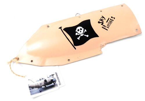 A section of an aircraft panel, from a Blackburn Buccaneer, Gulf War, painted with 'Sky Pirates' and a skull and crossbones flag, 43cm wide.