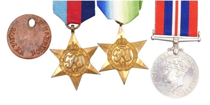A WWII medal group, comprising 1939-45 British War medal, Atlantic Star and 1939-45 Star, with ID tag, inscribed to KX141776 R Harrison, Royal Navy.