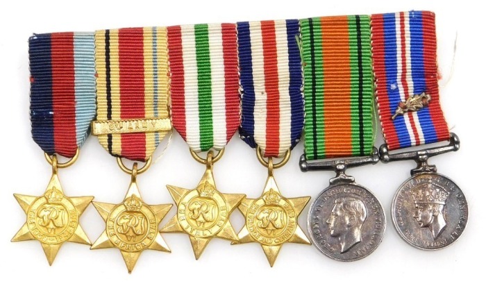 A WWII miniature medal group, comprising 1939-45 British War medal with oak leaf insignia (mentioned in dispatches), 1939-45 Star, Africa Star (with 8th Army clasp), Italy Star, France and Germany Star and Defence medal.