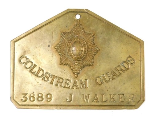 A brass identification plate for the Coldstream Guards, named to J Walker, number 3689, with regimental crest, the reverse stamped Duty and stamped name for Hobson and Sons, Lexington Street, London, 8.5cm x 11.5cm.