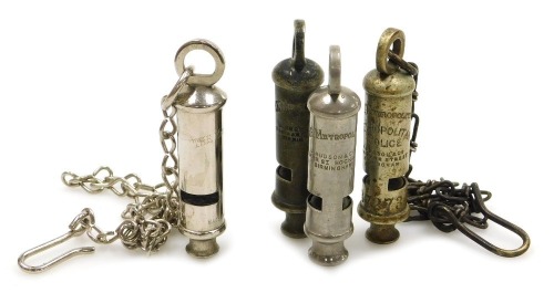 Four Metropolitan whistles by J Hudson & Co, two with chains.
