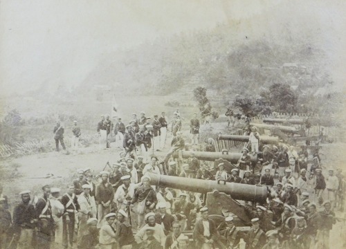A 19thC photographic reproduction of Royal Marines and British sailors, surrounding the captured Japanese guns and Shimonoseki, September 6th 1864, size of image 12cm x 17cm.