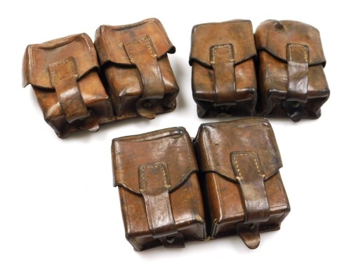 Three German WWI leather double ammunition belt pouches, all with indistinct stamped marks to the reverse.