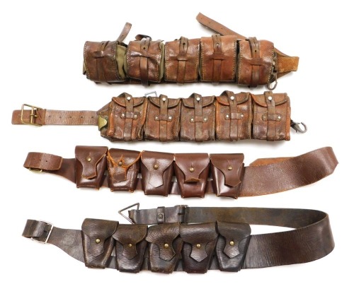 A WWI period canvas and leather ammunition pouch belt, with five pouches, and three leather ammunition bandoliers. (4)