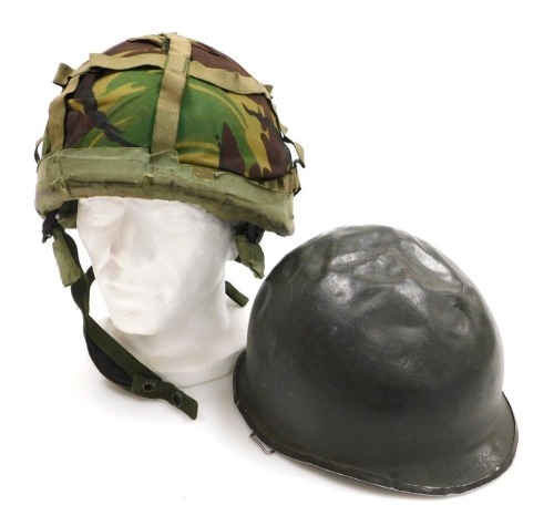 A Nato British Army helmet, and an US M1 type helmet (2)