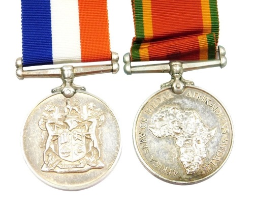 Two WWII South Africa medals, comprising 1939-45 South Africa War Services medal, and an African Service medal 1939-45, the latter inscribed to 240635 TB Powell.