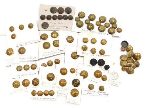 A collection of military brass buttons, including Lincolnshire Regiment, Norfolk Regiment, Queen's Own Dorset Yeomanry, Royal Tank Regiment, Royal Signals, East Yorkshire Regiment, and others. (1 tray)