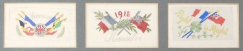 Three WWI silk postcards, one embroidered Honour, another 1915 and Remember, and the other Right is Might, in an oak frame.