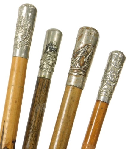 Four British Army bamboo and malacca cane swagger sticks, all with regimental crest terminals, for the Honorable Artillery Company, the Notts & Derby Regiment, Royal Engineers and another for Cinque Ports Volunteers.