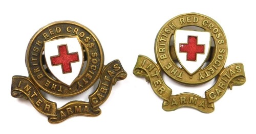 Two British Red Cross Society badges, with red and white enamel central shields.