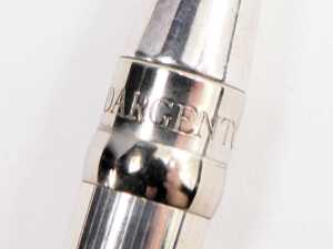A silver cased propelling pencil, with engine turned decoration, together with a Yard O' Lead metal cased ball point pen and a Unoargento Italian ball point pen, marked 925. - 2