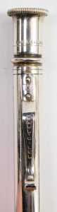 A silver cased propelling pencil, with engine turned decoration, together with a Yard O' Lead metal cased ball point pen and a Unoargento Italian ball point pen, marked 925. - 3