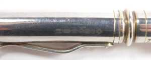 A silver cased propelling pencil, with engine turned decoration, together with a Yard O' Lead metal cased ball point pen and a Unoargento Italian ball point pen, marked 925. - 4
