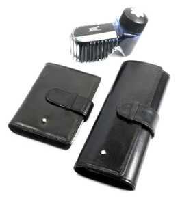 A Montblanc leather card holder, with various plastic inserts, 10.5cm x 8cm, together with a pen case, 16cm wide, and a bottle of black ink, 50ml.
