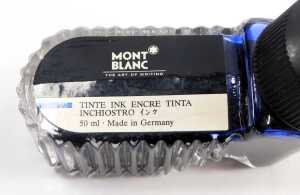 A Montblanc leather card holder, with various plastic inserts, 10.5cm x 8cm, together with a pen case, 16cm wide, and a bottle of black ink, 50ml. - 2