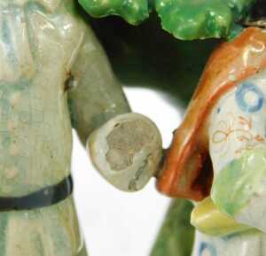 An early 19thC Staffordshire pottery figure group, modelled as The Tithe Pig Group, 17cm high. (AF) - 4
