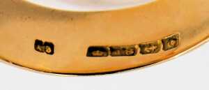A Victorian 18ct gold buckle ring, the raised buckle design inset with round brilliant cut diamond, star set, approx 0.25ct, Birmingham 1888, ring size V&frac12;, 10.7g all in. - 2