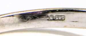 An amethyst and diamond ring, the briolette cut amethyst high claw set, in a surround of diamonds, in white metal, stamped 14k, size Q, 4.0g. - 2