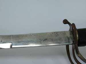A 19thC officer's dress sword, with black leather wire rung hilt and a curved blade, in leather scabbard, with patterned blade, 95cm long. - 4