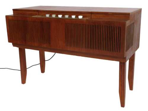 A HMV teak cased record player, with a Garrard 3000 player, 66cm high, 92cm wide, 50cm deep.