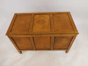 A 20thC oak blanket box, with three sectional veneered top, panelled front and sides, turned on stiles, 61cm high, 92cm wide, 47cm deep. - 2