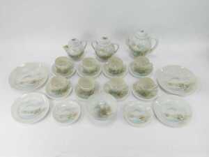 A 20thC Japanese eggshell porcelain tea set, comprising teapot, milk jug, sugar bowl, eight cups and saucers, four medium plates and a bowl, each decorated with buildings, mountains and trees, on a white ground. - 2