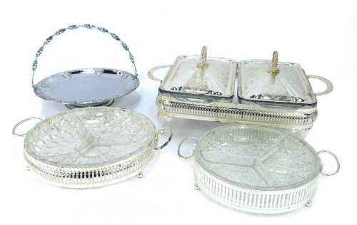 A group of silver plated table wares, comprising a two piece breakfast server, with glass inserts and silver plated rim, 11cm high, 30cm wide, two glass and silver rimmed serving dishes, 21cm wide, and a silver plated and berry design with swing handle, 2