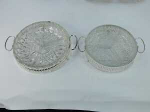 A group of silver plated table wares, comprising a two piece breakfast server, with glass inserts and silver plated rim, 11cm high, 30cm wide, two glass and silver rimmed serving dishes, 21cm wide, and a silver plated and berry design with swing handle, 2 - 3